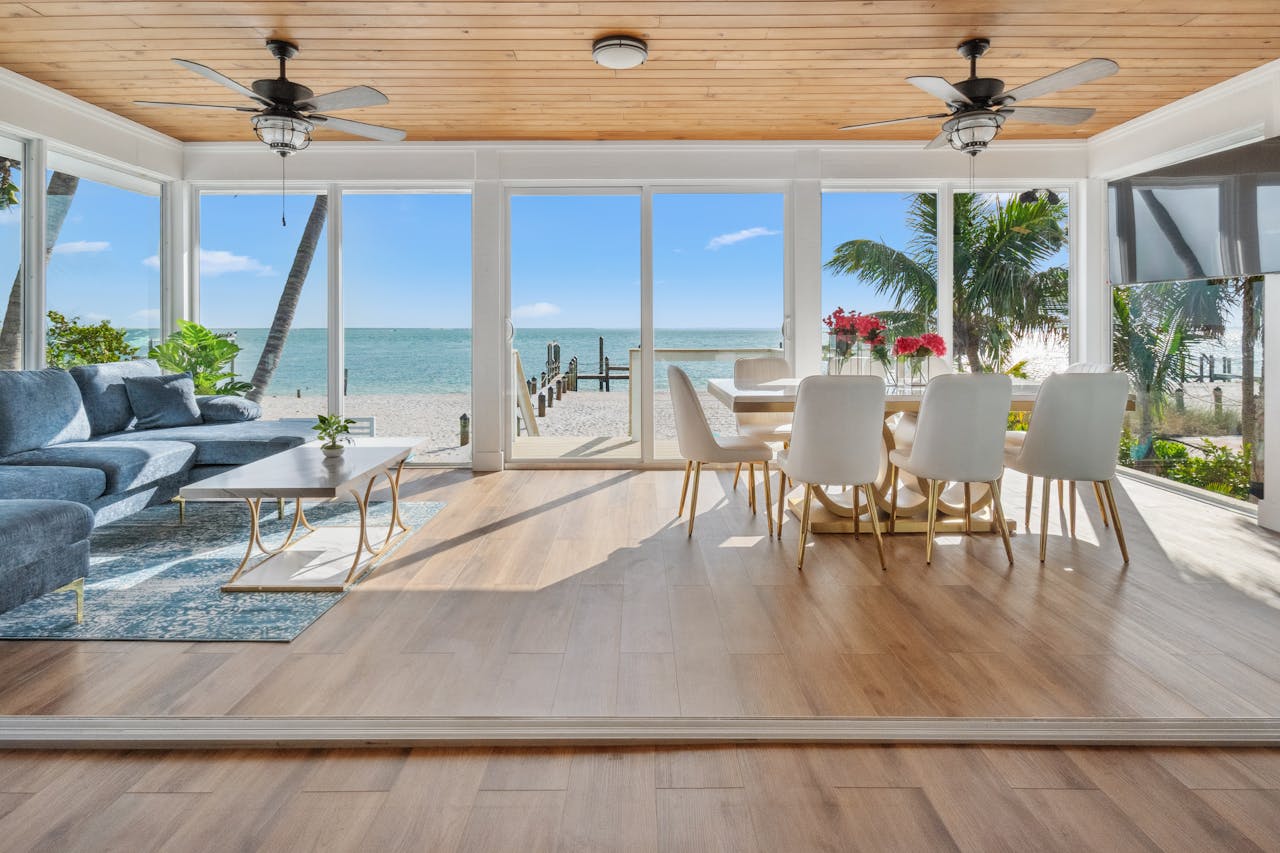 Spacious beachfront living room with ocean view, perfect for relaxation.